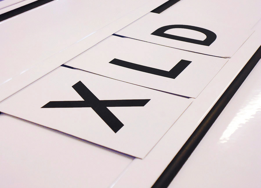 Close Up Of Tile Signs in Grip Rail