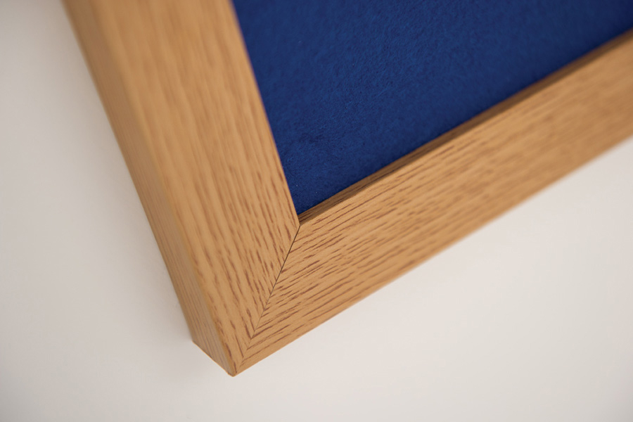 Close Up of Wood Effect Notice Board